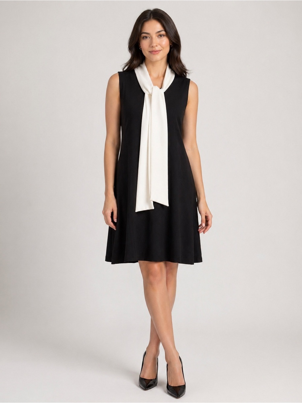 Calvin Klein sz 12 black sheath dress with creamy white tie at neck. NWT